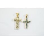 Two Gold Stone Set Crosses. Attractive cross pendants, the larger set with 6 clear faceted stones.