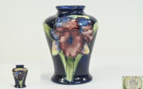 W. Moorcroft Small Vase ' Orchids ' on Blue Ground.