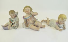 A Collection of 20th Century Piano Baby Dolls ( 3 ) In Total.