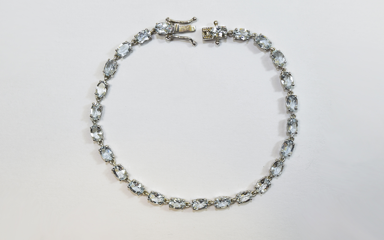 Aquamarine Tennis Bracelet, a single row of oval cut Brazilian aquamarine, totalling 8.