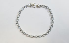 Aquamarine Tennis Bracelet, a single row of oval cut Brazilian aquamarine, totalling 8.