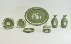 Small Collection of Green Wedgwood Pottery including pair of bud vases, oval dish and pin dishes.