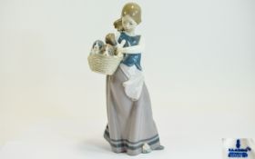 Lladro Porcelain Figurine ' Girl with Puppies ' Model No 1311. Issued 1974 - 1996. Height 9.