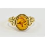 9ct Gold Dress Ring Set With Central Oval Amber Within A Scroll Setting, Fully Hallmarked,