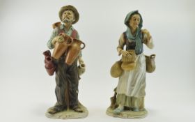 Pair Of 2 Modern Figures by Royal Meridian, man a woman carrying food and drink.