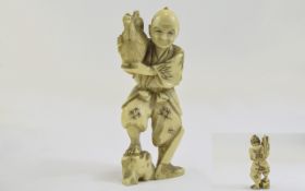 Japanese - Good Quality Late 19th Century Carved Ivory Figure - Meiji Period ' Man Holding a