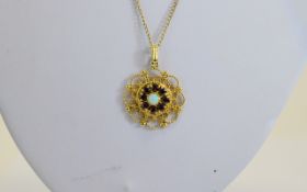 Ladies - Circular 9ct Gold Pendant Drop Set with Opals and Garnets with Open Worked Surround.