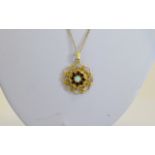 Ladies - Circular 9ct Gold Pendant Drop Set with Opals and Garnets with Open Worked Surround.