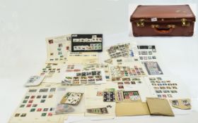 Old brown suitcase full of stamp oddment