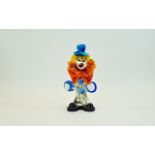 Murano Glass Clown Small glass clown with large orange/red bow and whimsical blue top hat.