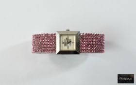 Ladies Swarovski Bracelet Watch Square dial with pink Swarovski bracelet strap.
