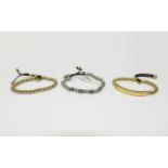 3 Michael Kors Expandable Bracelets, two gold coloured & one silver coloured.