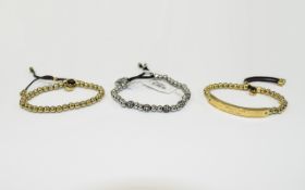 3 Michael Kors Expandable Bracelets, two gold coloured & one silver coloured.