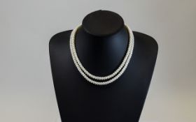 Twin Strand of Cultured Pearls 16" with gold coloured fastening.