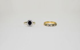Two Silver Sapphire Set Rings.