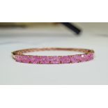 Pink Crackled Quartz Bangle, over 10cts of oval cut, bright pink quartz, the sparkle enhanced by the