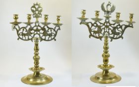MATCHED PAIR OF GERMAN BRASS FOUR-LIGHT CANDELABRA 18TH CENTURY