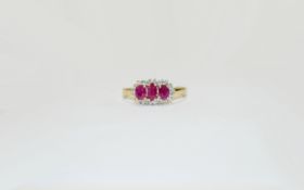 9 ct Diamond and Ruby Cluster Ring. Pretty, raised central setting with 3 oval rubies set amongst