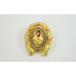 Victorian Gilt Metal Brooch Set With A Central Red Faceted Stone Enamelled Border And Realistically