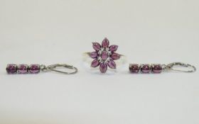 Rhodolite Garnet Cluster Ring and Drop Earrings, the ring comprising nine oval cut,