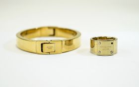 Michael Kors Bangle and Ring ring is missing a screw & bangle is missing the hinge screw.