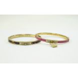 2 Michael Kors Bangles, both stone set, one brown & gold coloured and one pink & gold coloured.