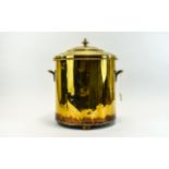 Brass Coal Bucket, with two handles and standing on three feet. 15 inches in height.