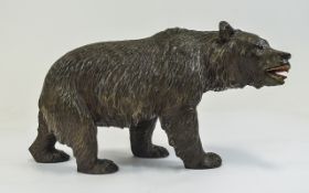 A Carved Black Forest Bear. 8.5 Inches In Length, Bead Eyes and Painted Mouth.
