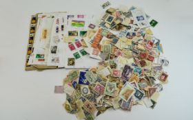 Huge tub of stamps from around the owrld, mostly off paper.