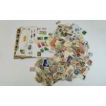 Huge tub of stamps from around the owrld, mostly off paper.