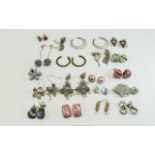 Nineteen Pairs of Costume Earrings in a variety of styles and materials, both pierced and clip-ons,