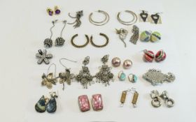 Nineteen Pairs of Costume Earrings in a variety of styles and materials, both pierced and clip-ons,