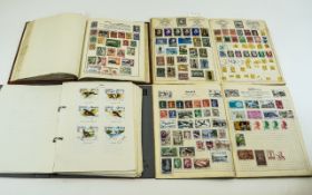 Stamp Albums Collection of four albums,