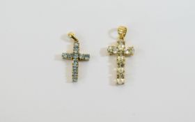 Two Gold Stone Set Crosses. Attractive cross pendants, the larger set with 6 clear faceted stones.