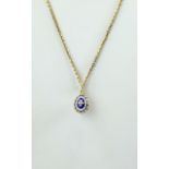 14ct Gold and Enamel Egg Shaped Pendant Drop. Marked 585 with Attached 9ct Gold Box Chain.