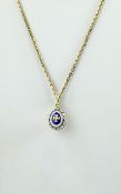 14ct Gold and Enamel Egg Shaped Pendant Drop. Marked 585 with Attached 9ct Gold Box Chain.