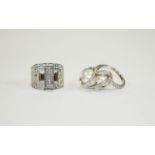 Swarovski Rings Two silver tone and crystal set rings.