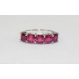 Ruby Five Stone Band Ring, comprising five cushion cut rubies of equal size and good colour,