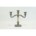 Candle Stick Plated three armed candle stick on square base with grape and vine leaf embossed