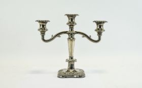 Candle Stick Plated three armed candle stick on square base with grape and vine leaf embossed