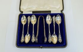 George V Boxed Set of Six Silver Ornate Teaspoons and Matching Sugar Tongs.