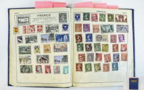 Blue Victory stamp album containing mix of old and new stamps