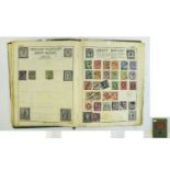 An old battered A5 Victory stamp album filled with many old stamps.