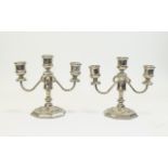 Pair Of Silver Plate Squat Candlesticks Three armed candlesticks on octagonal base.