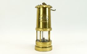 Brass Miners Lamp Embossed to front with rose and 'England' mark. Approx height 8.5 inches.