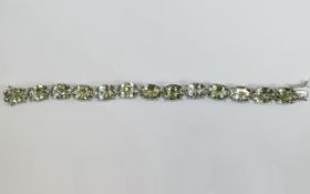 Green Amethyst Tennis Bracelet, 70cts of oval cut green amethyst set in platinum vermeil and silver,