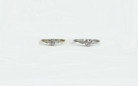 Two Silver Solitaire Rings.