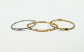 3 Michael Kors Stone Set Bangles, 1 silver coloured, 1 gold coloured & 1 rose gold coloured.