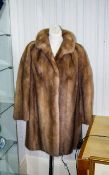 Mink Coat Blonde mink mid-length coat.