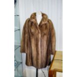 Mink Coat Blonde mink mid-length coat.